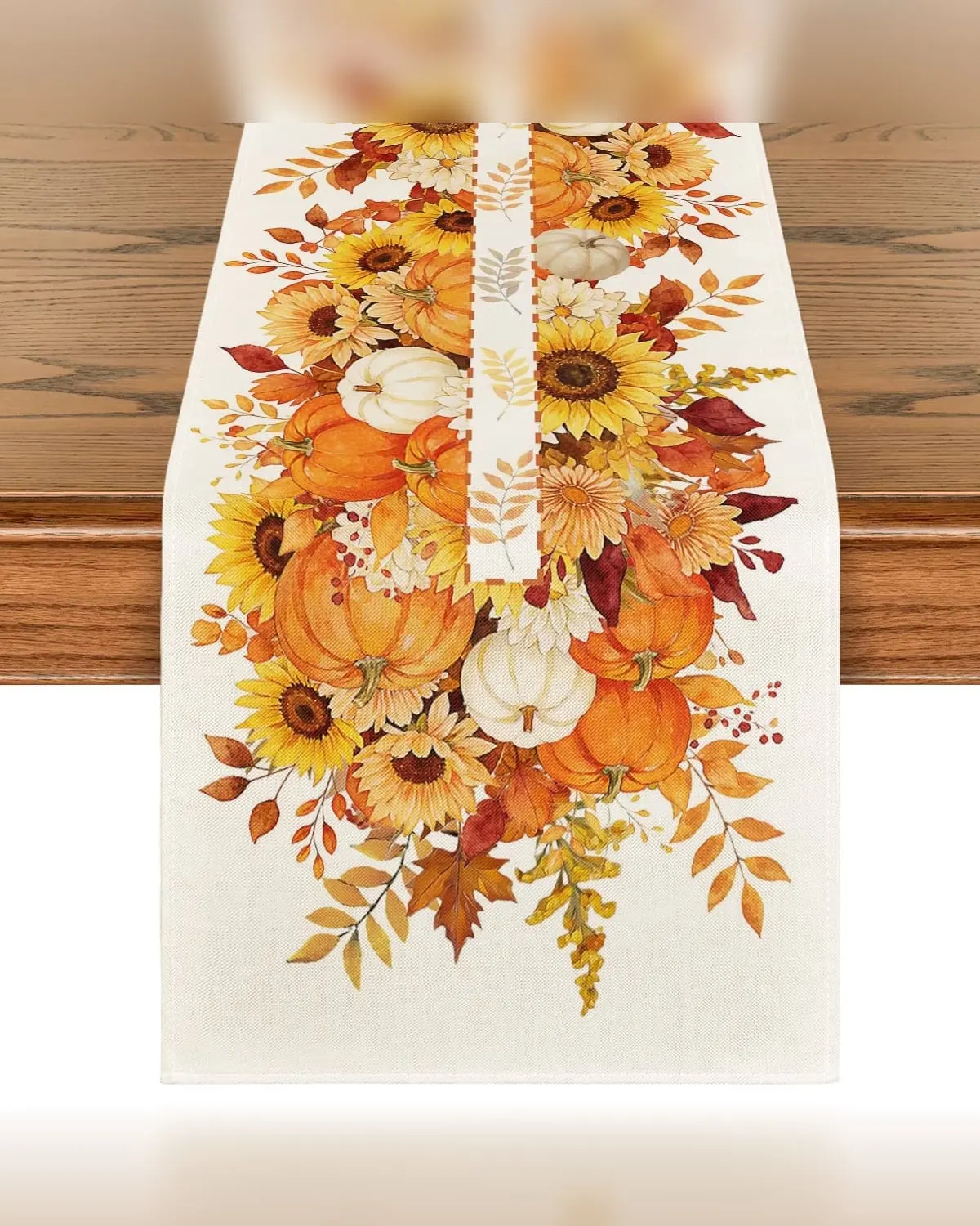 Fall table runner printed with sunflowers, maple leaves and pumpkins on a small dining table