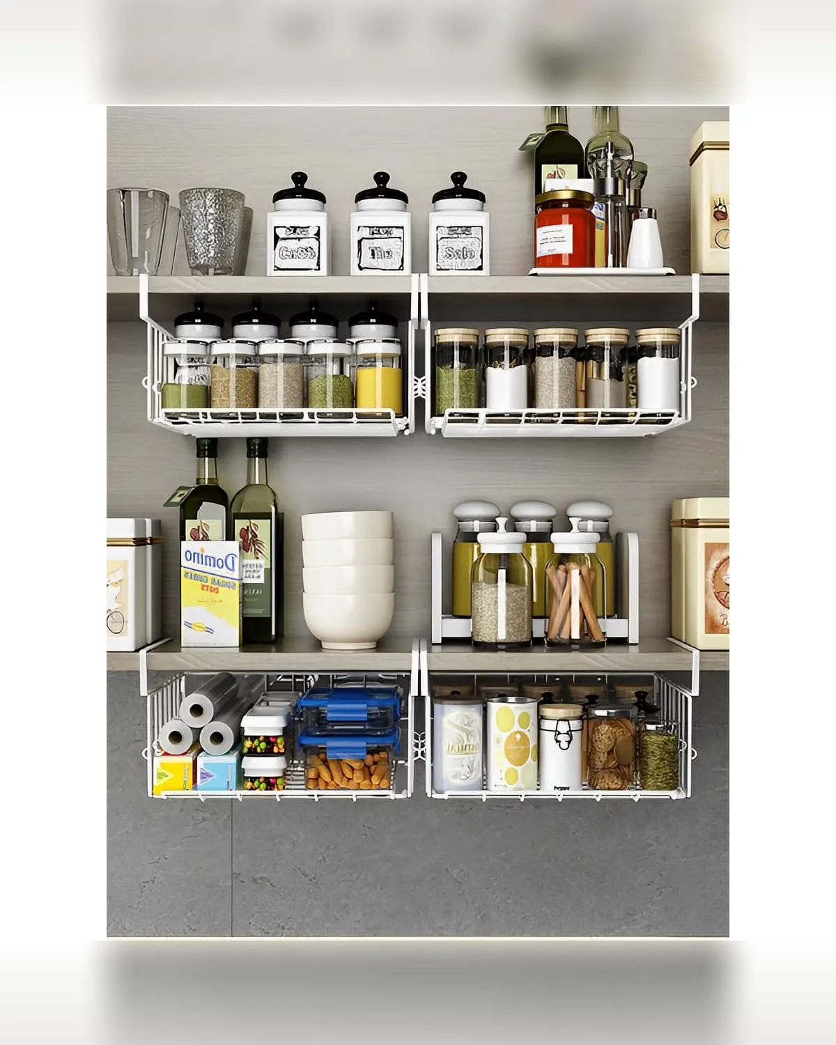 Two metal under-shelf wire storage baskets on a kitchen cabinet shelf