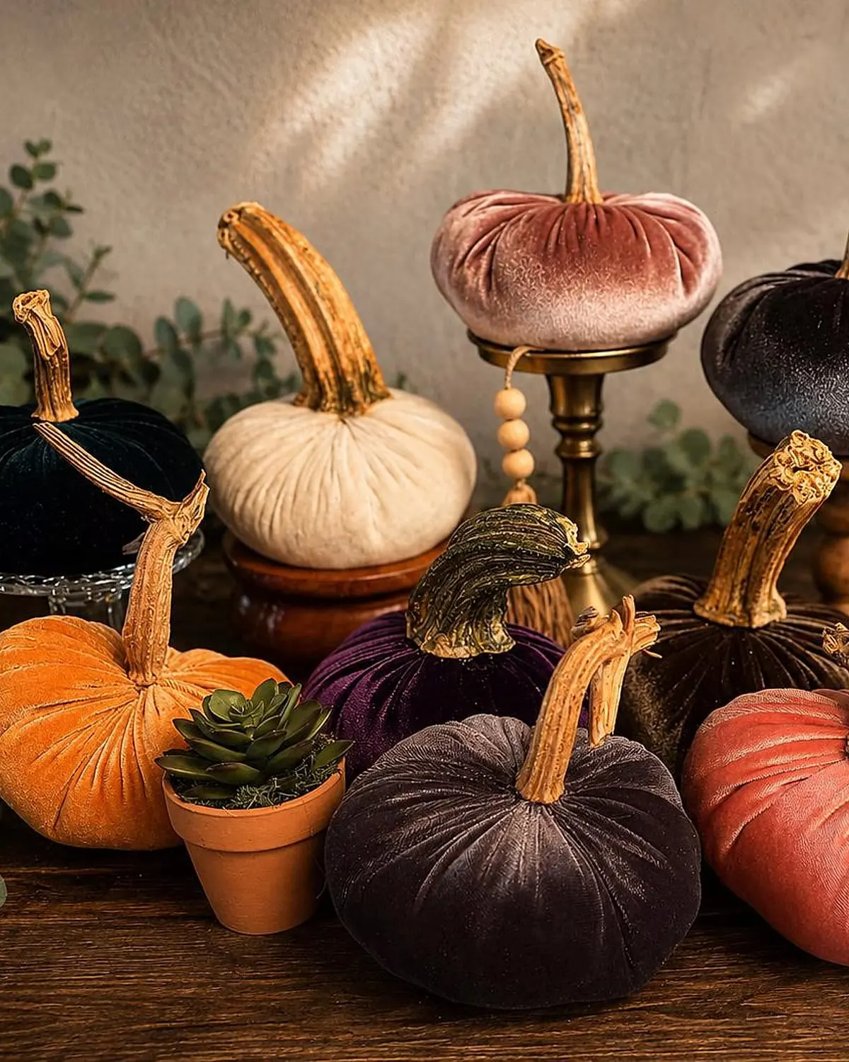 Handmade velvet pumpkin with a real dried stem on a shelf