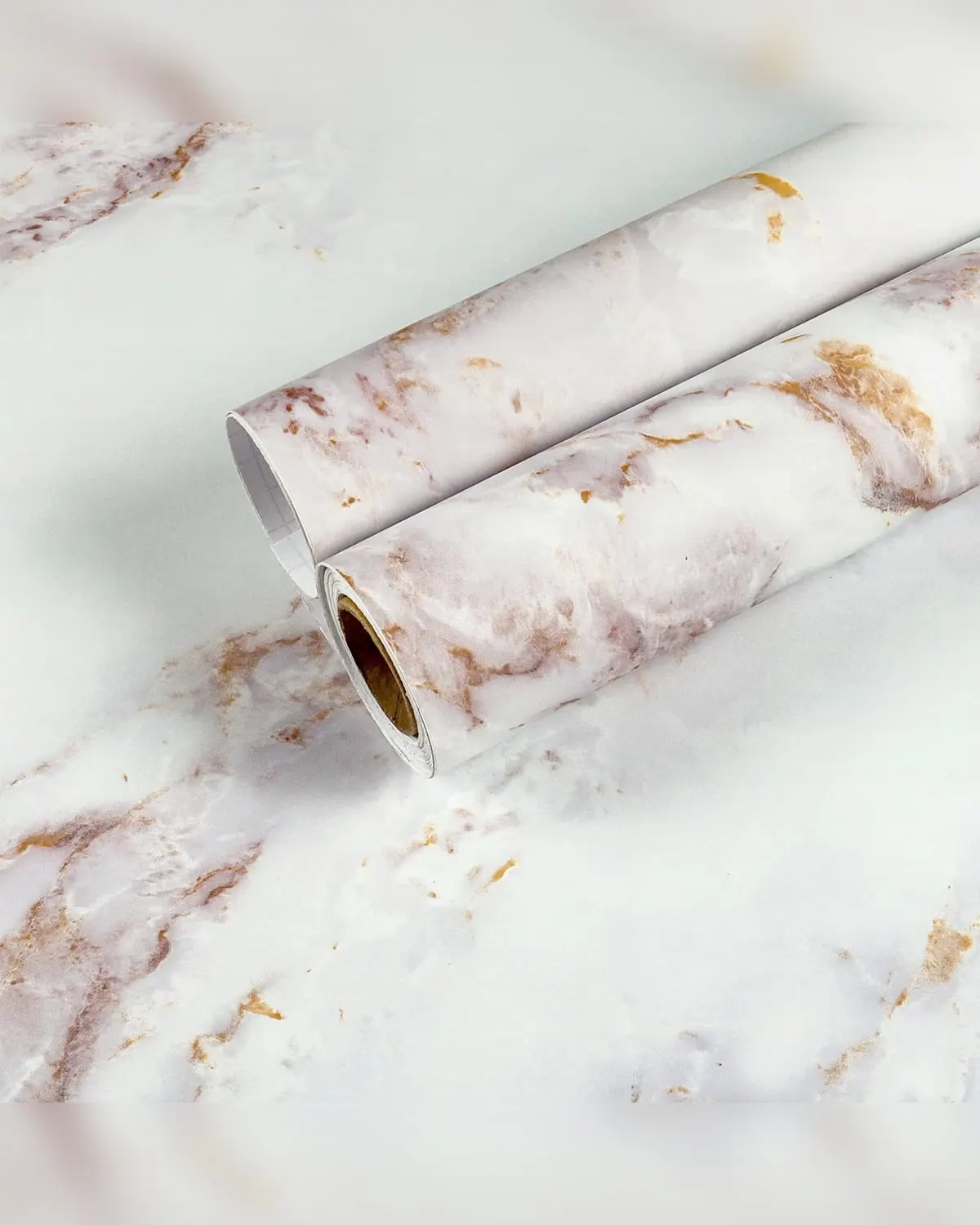 White and gold marble contact paper covering a kitchen counter