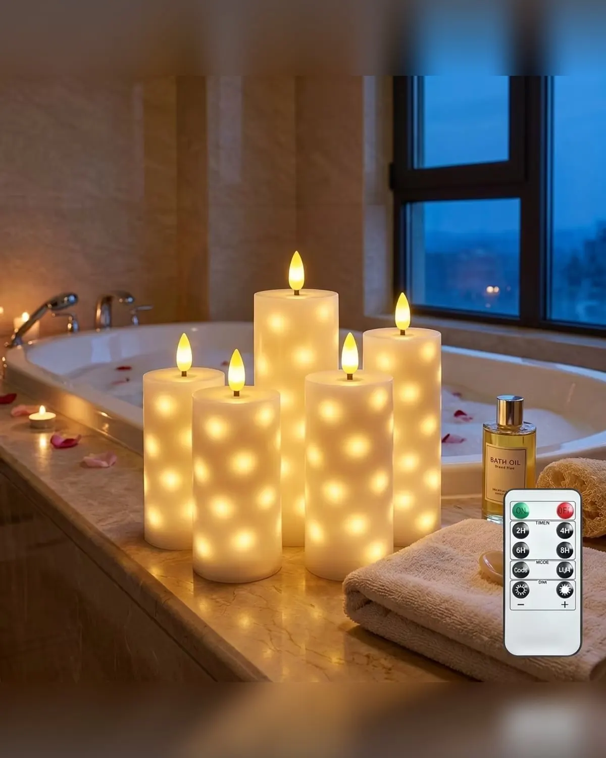 Ivory flameless LED pillar candles with built-in star lights glowing, with a remote
