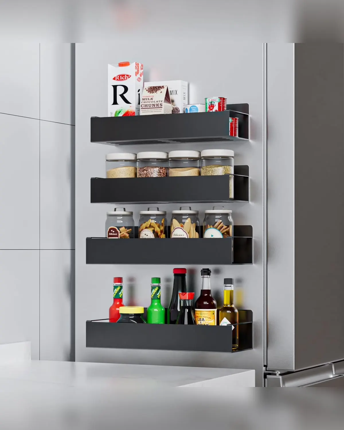 Four black magnetic spice shelves mounted on the side of a refrigerator