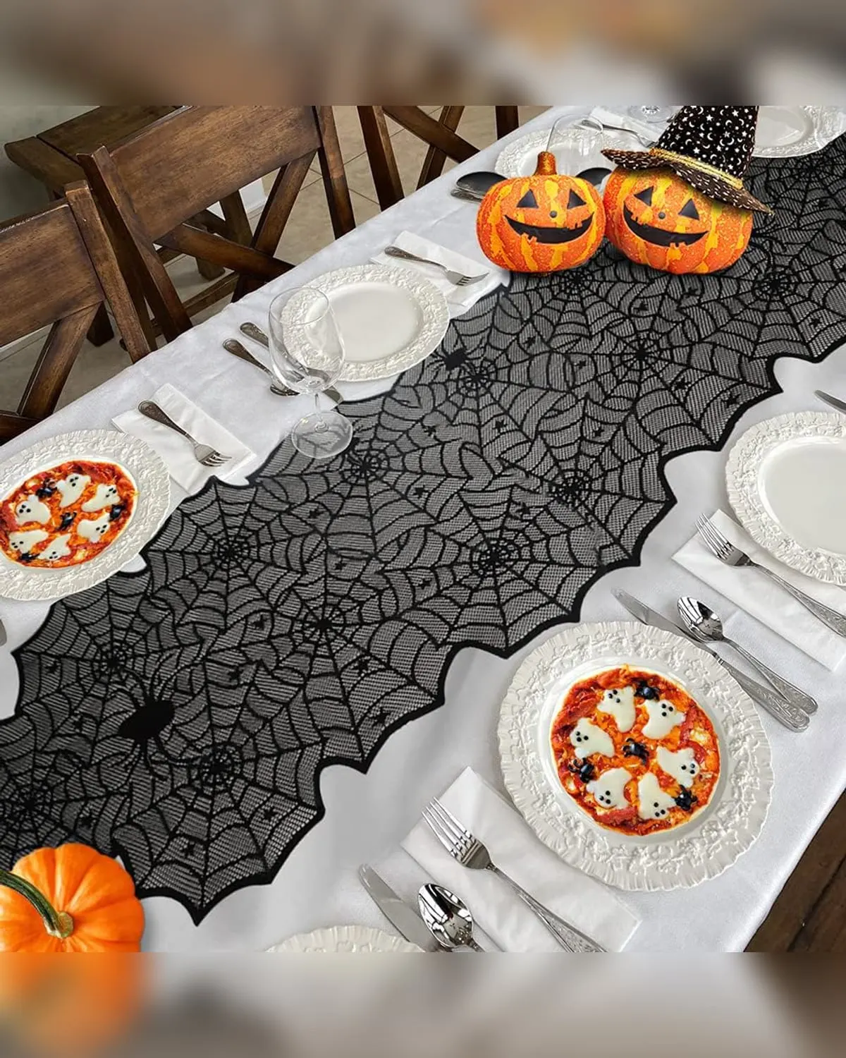 Black lace spiderweb Halloween table runner on a dining table