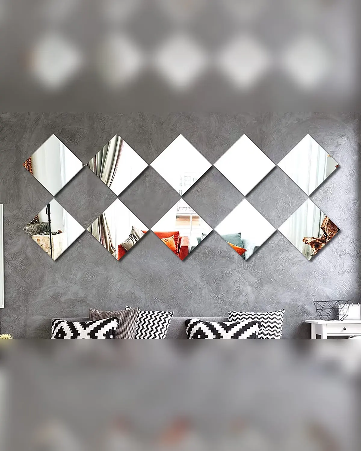 Self-adhesive mirror tiles arranged in a diamond band across a grey wall