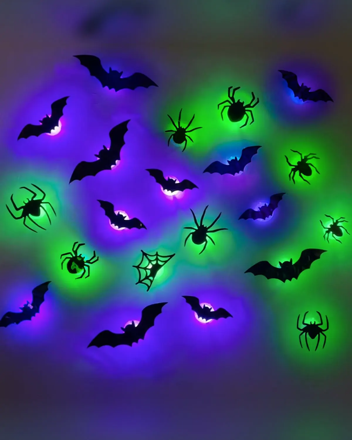 Cluster of glow-in-the-dark 3D bat wall stickers climbing an apartment wall