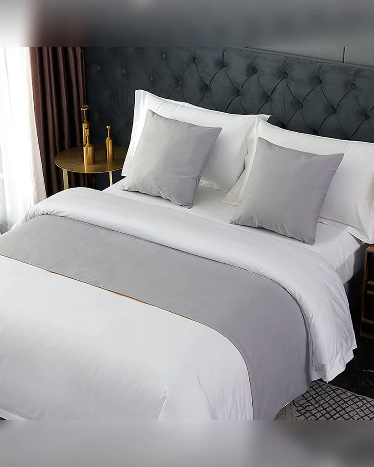 Grey farmhouse bed runner across the foot of a made bed