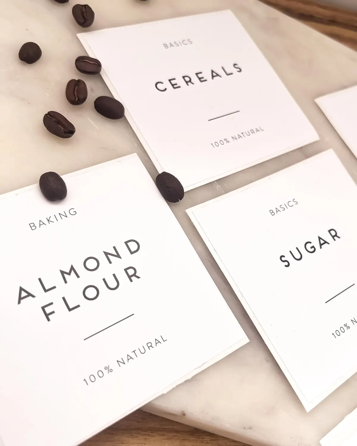 Minimalist waterproof labels on pantry jars