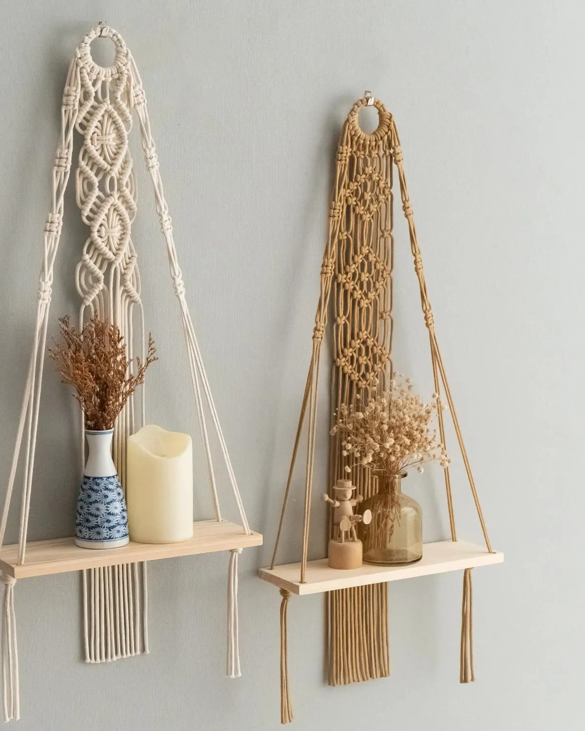 Boho macrame wall hanging shelf with a plant on a bathroom wall