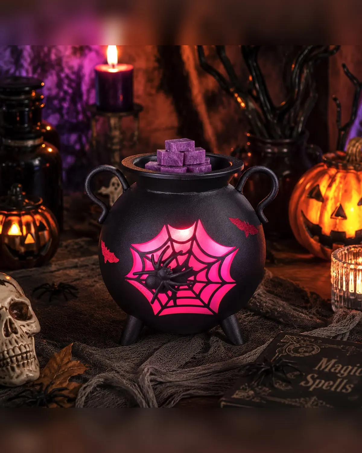 Gothic cauldron-shaped electric wax warmer with spider-web glow